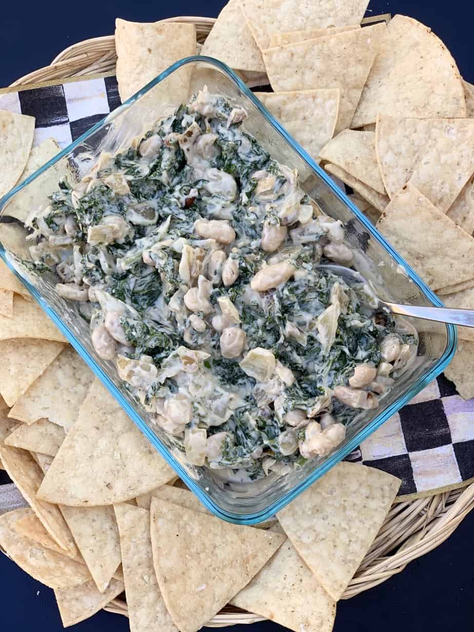 Creamy kale & white bean dip served with tortilla chips.
