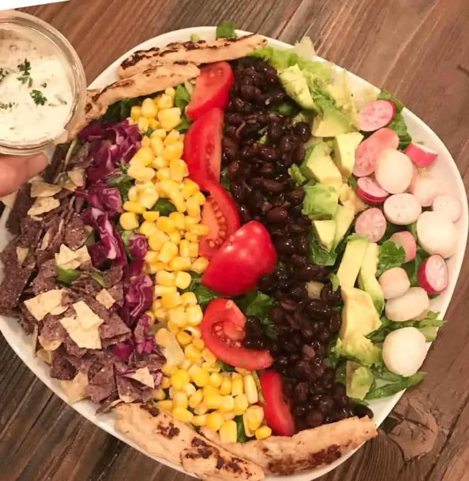 Taco salad with vegan ranch and vegan chicken.