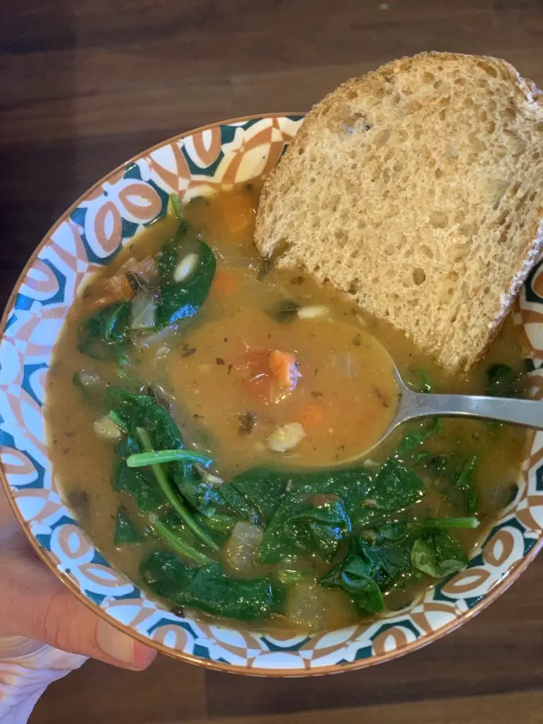 One of the easy Trader Joe's vegan meals: refrigerated soup with greens and bread.