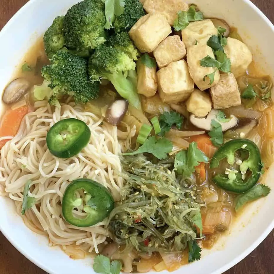 Spicy miso ramen bowl with air fried tofu, broccoli, seaweed, and kimchi.