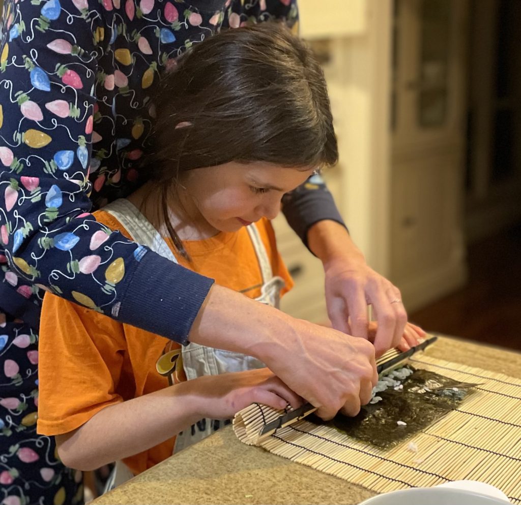 Family sushi night! Jenn and her daughter rolling sushi!