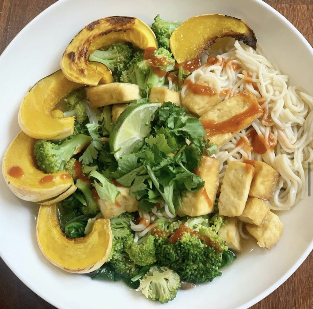 Miso ramen bowl with air fryer tofu, roasted acorn squash, broccoli, cilantro, and lime.