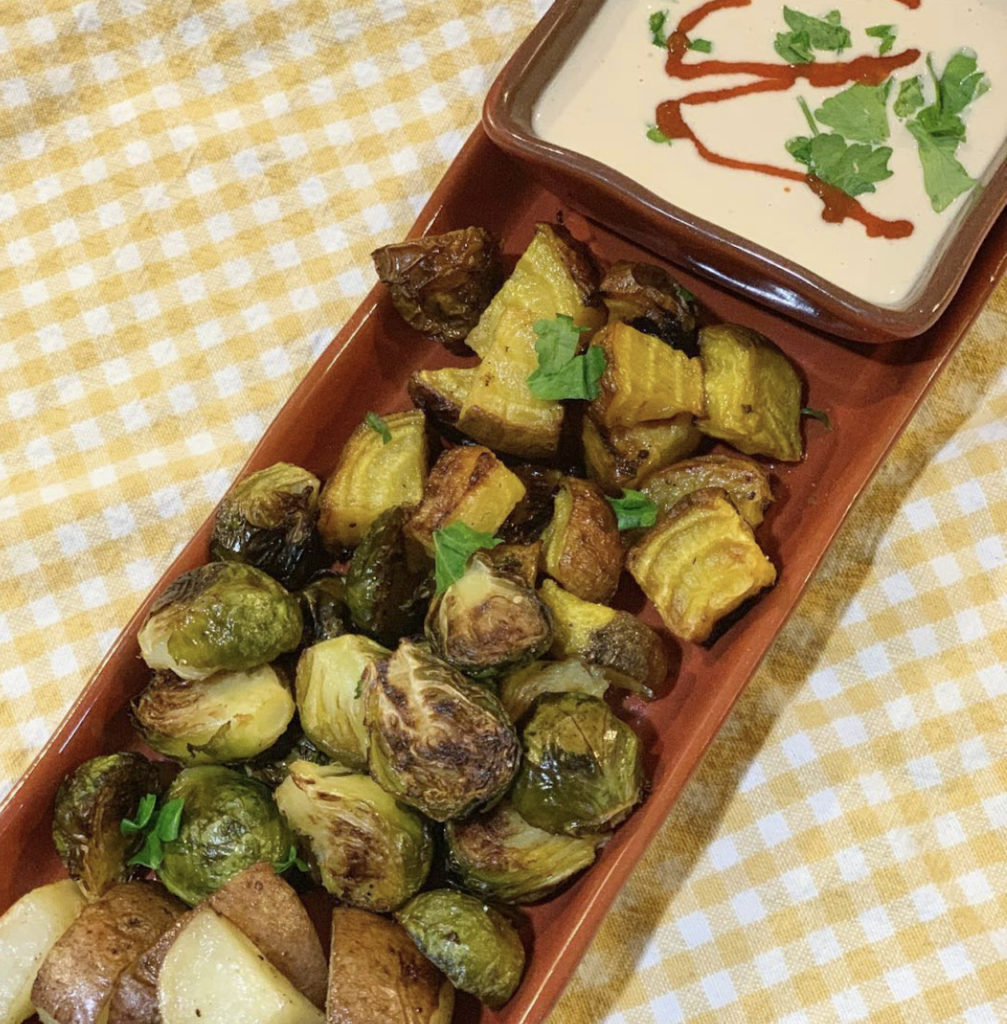 Roasted veggies with lemon herb tahini sauce.