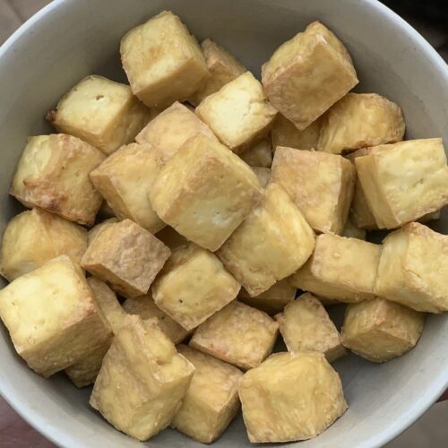 Air fried tofu in a bowl.