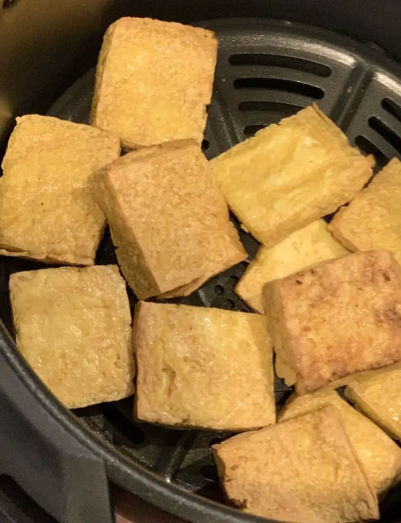 Air fried tofu in 2 inch flat square shape.