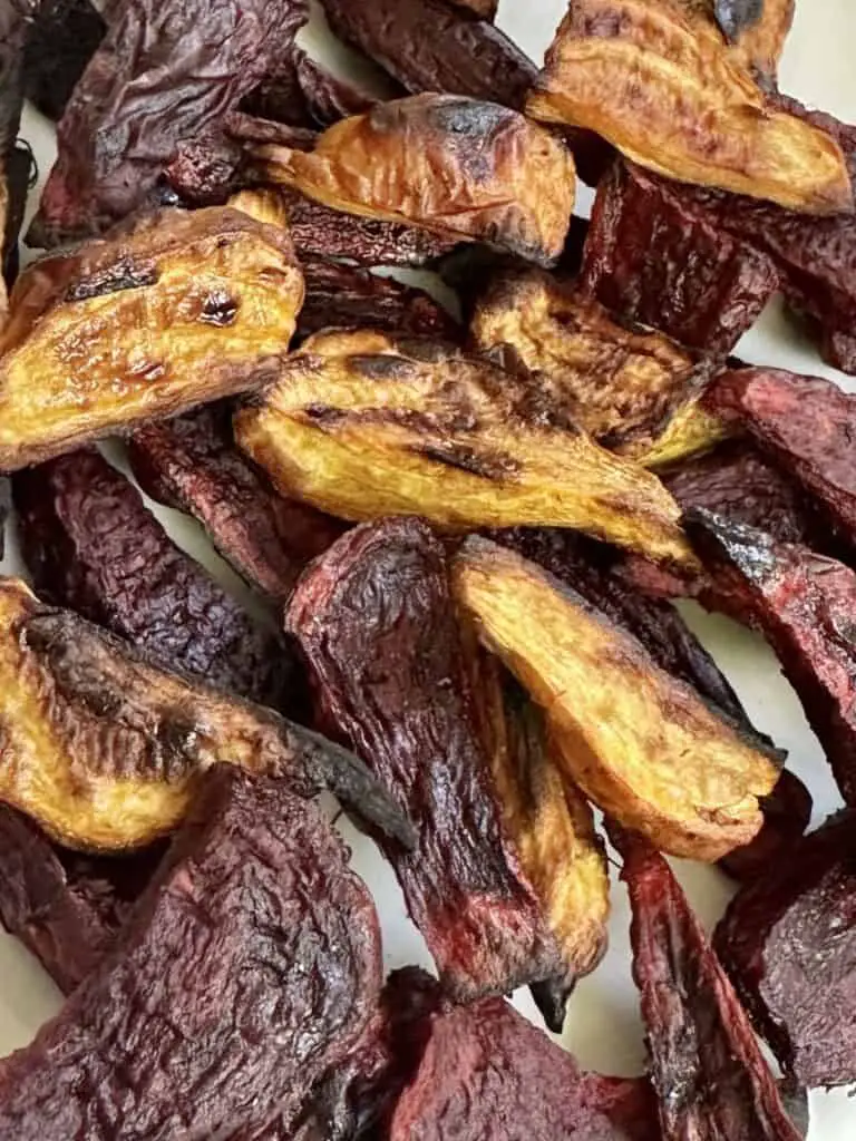 Close up of crispy roasted beets, both red and golden.