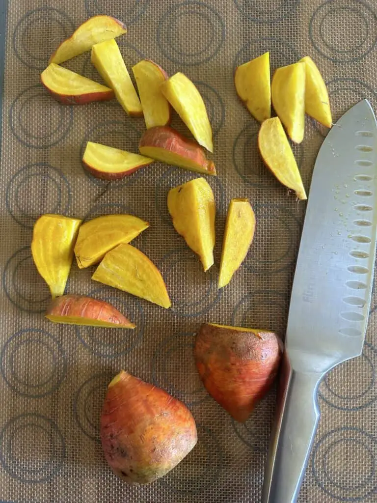 Slicing beets into 1/2 inch pieces.