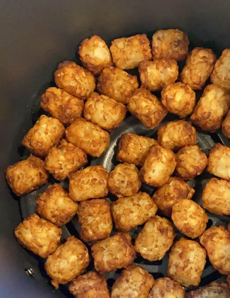 Trader Joe's tots, crispy and ready to devour in the air fryer basket!