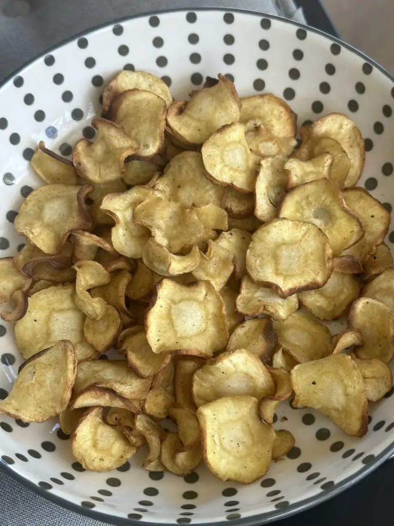 Plate of air fryer parsnip crisps.