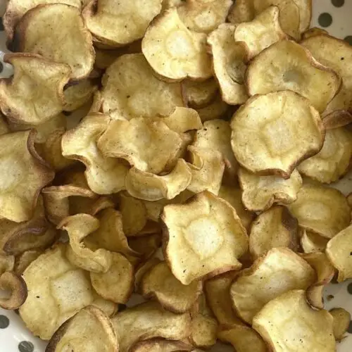 Close up of air fryer parsnip chips.