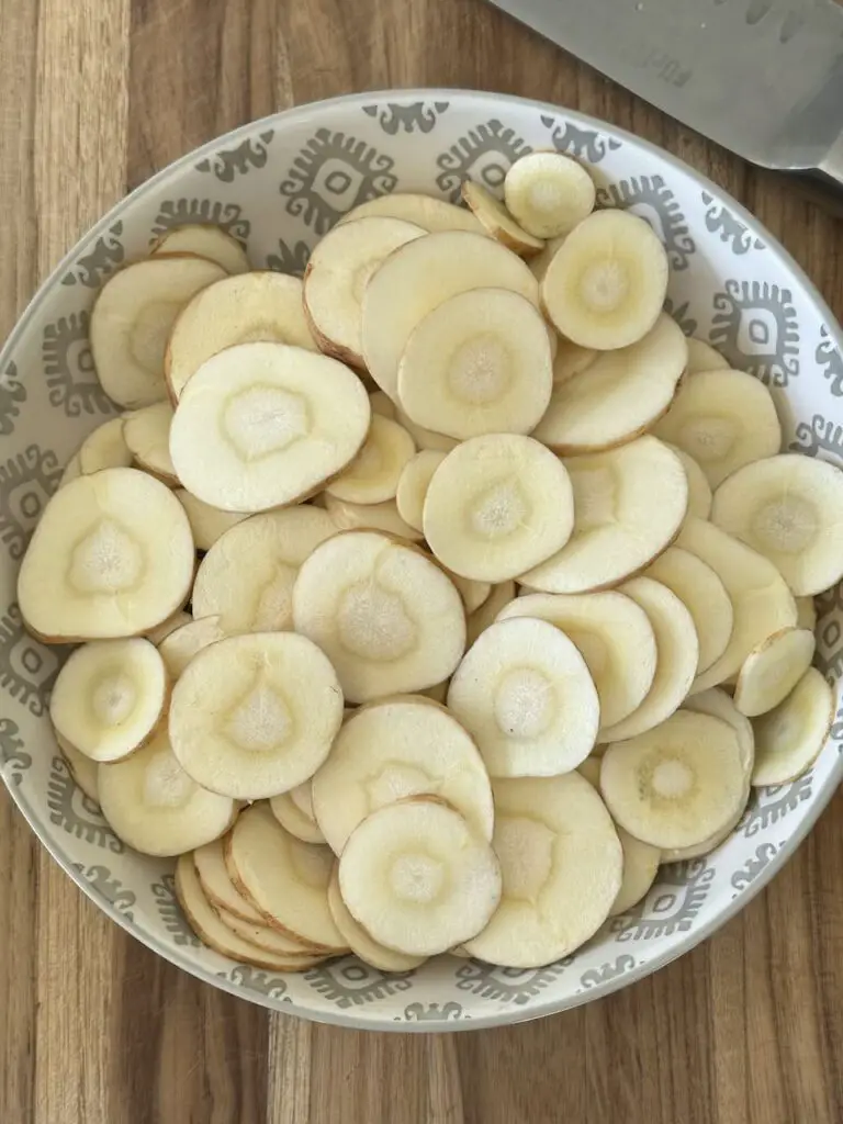 Raw slices of parsnip chips.