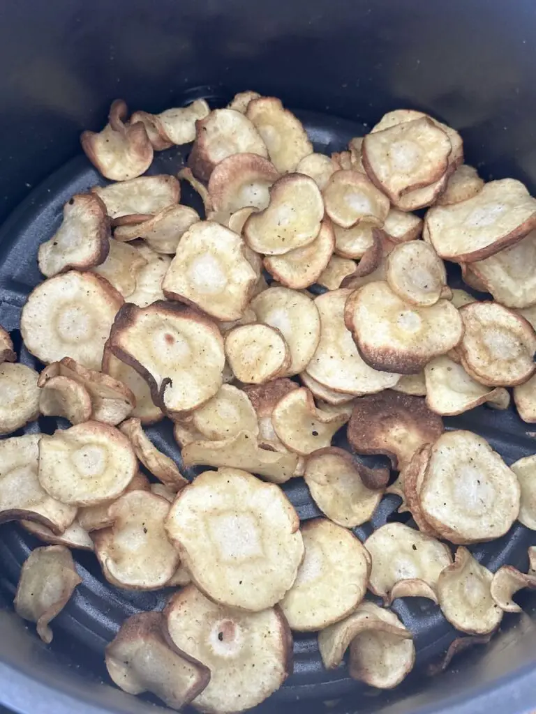 Parsnips are ready to come out of the air fryer.