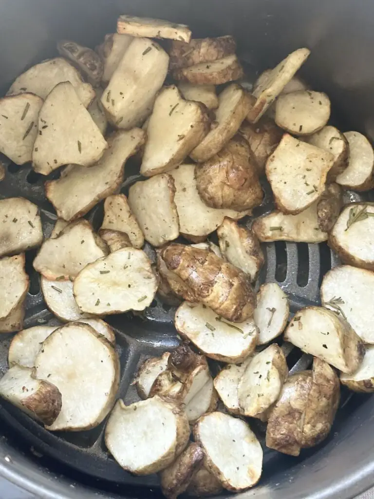 Sunchokes in air fryer after 10 minutes.