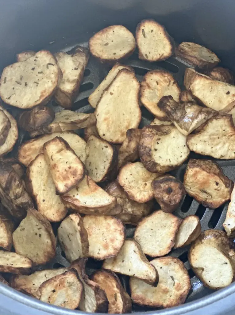 Sunchokes in air fryer after 15 minutes.