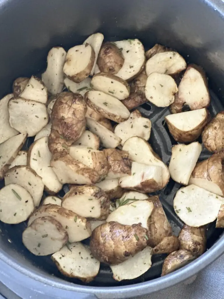 Sunchokes in air fryer after 5 minutes.