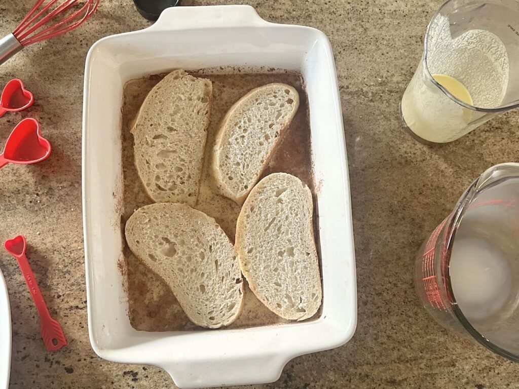 Bread soaking in custard.