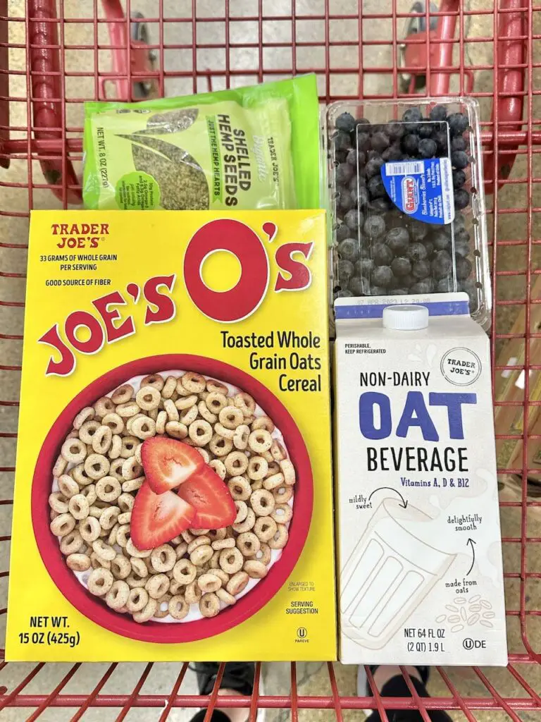 Basket of cereal meal idea: cereal, oat  milk, berries, and hemp seeds.