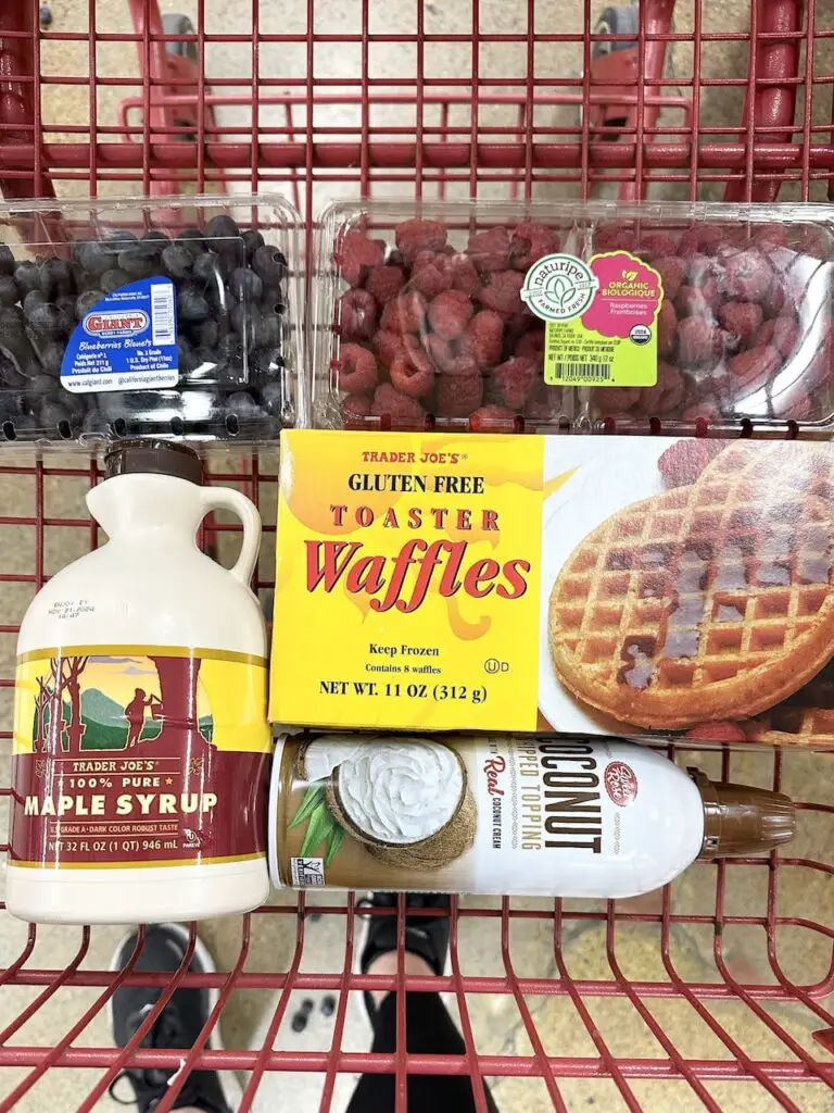 Shopping cart filled with waffle meal idea groceries.