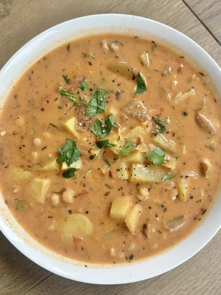 Vegan potato chowder with chickpeas and tomatoes.