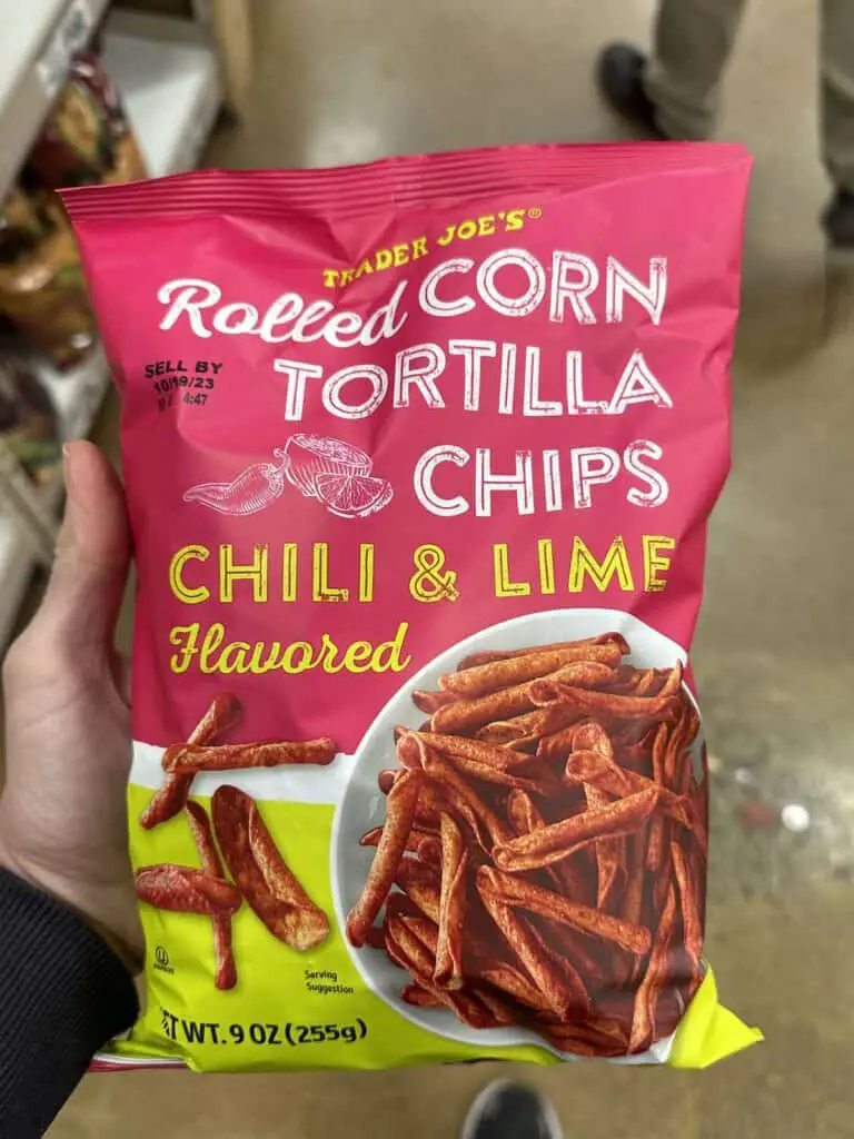 Bag of rolled corn tortilla chips, on of the best Trader Joe's vegan snacks.