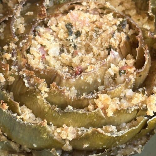 Vegan stuffed artichoke after baking.