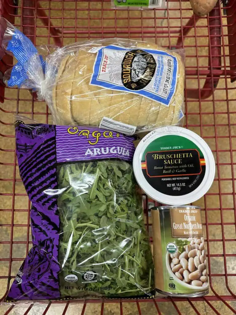 Shopping cart with ingredients for white bean bruschetta toasts.