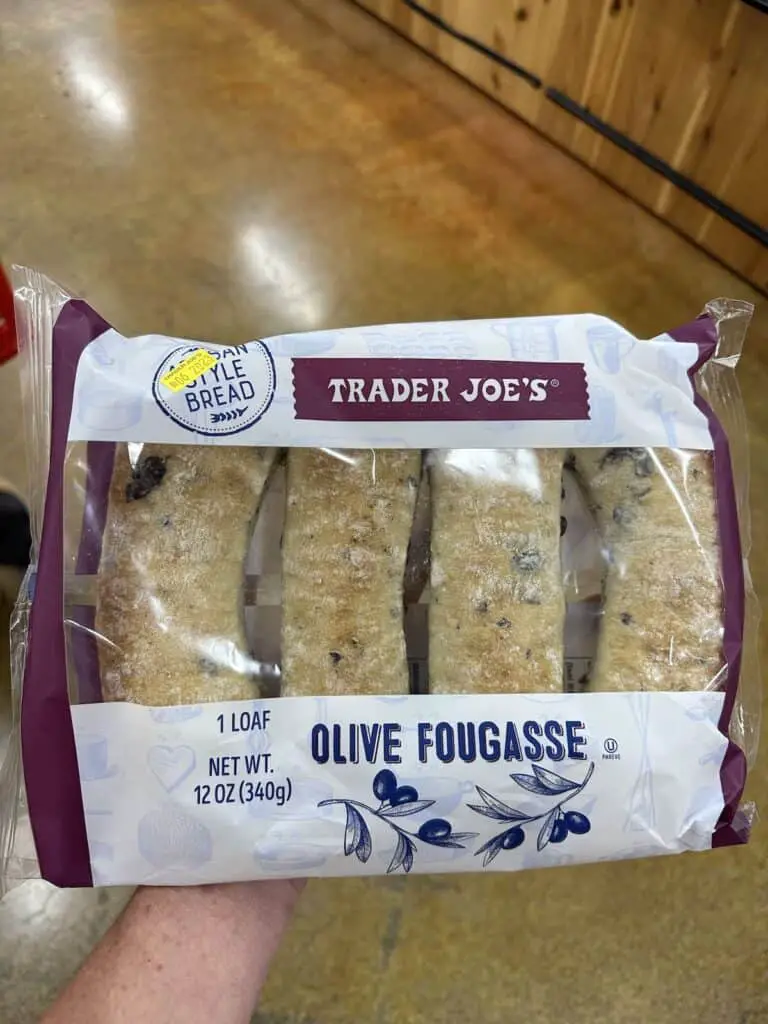 Olive fougasse bread in a plastic bag.