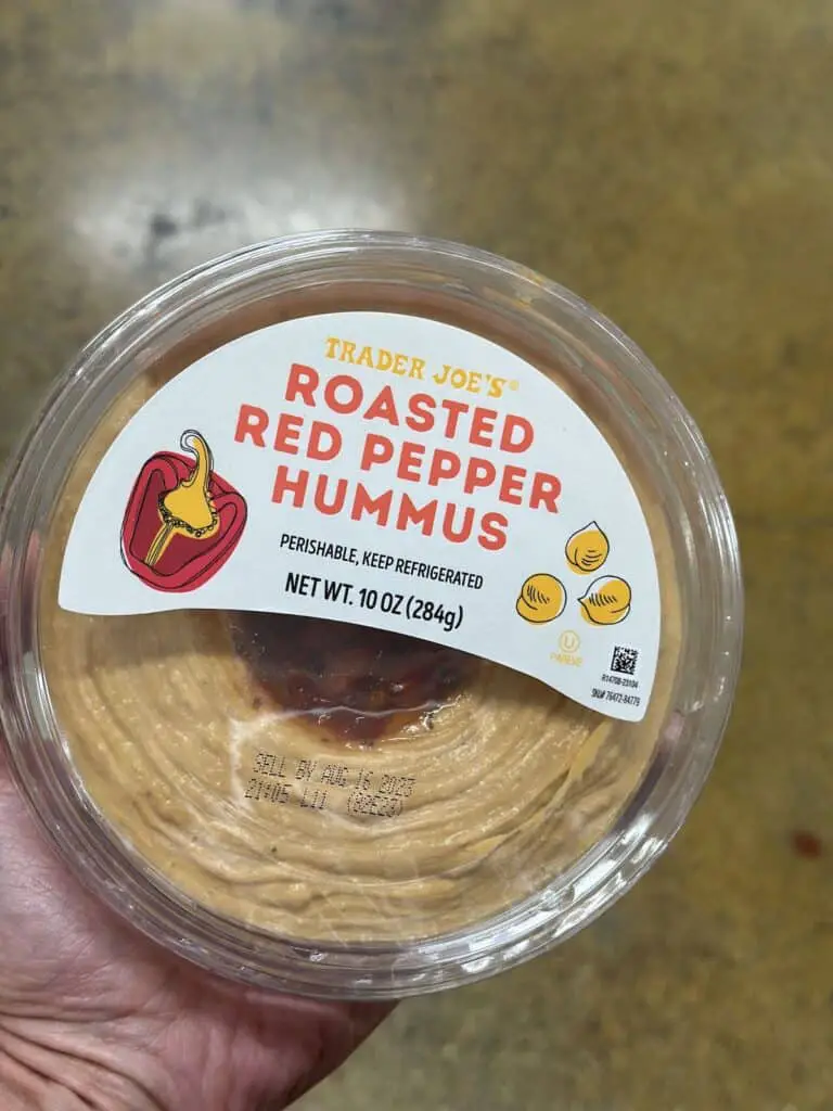 Tub of roasted red pepper hummus.