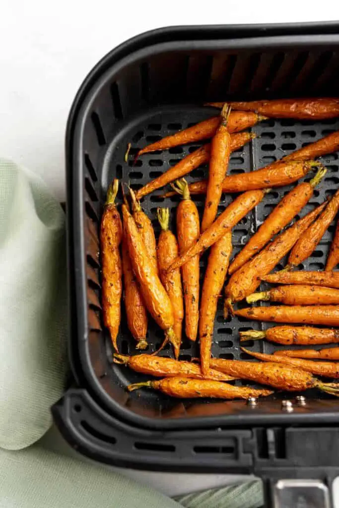 Baby carrots ready to come out of the air fryer.
