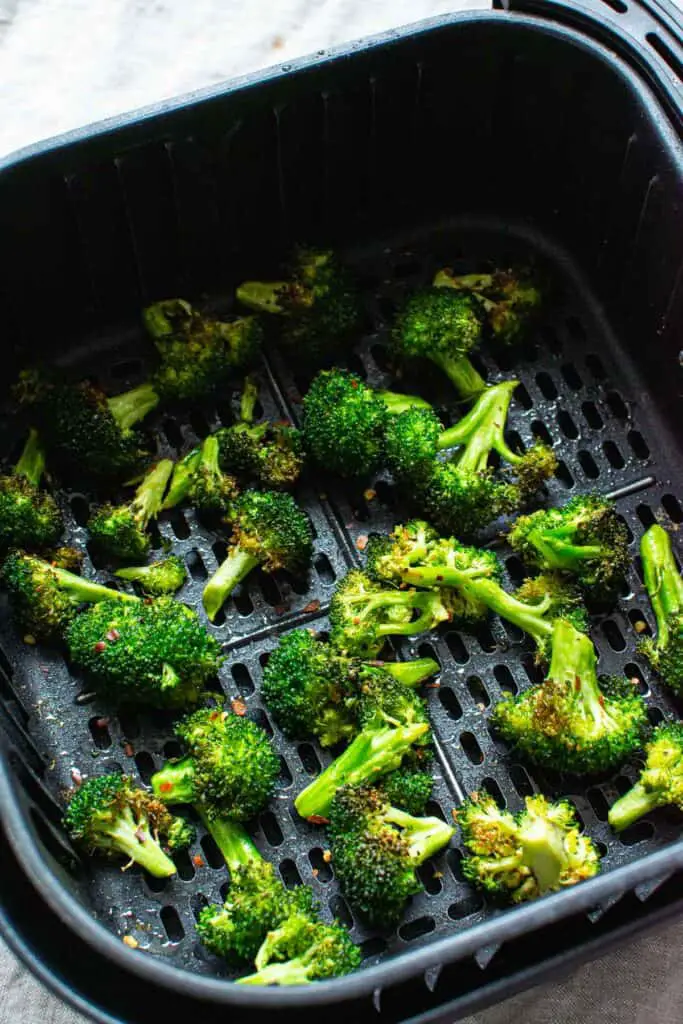 Broccoli in air fryer ready to come out.