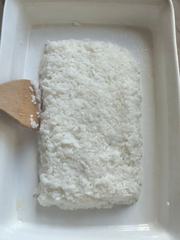 Rice in pan, shaped as a rectangle, with 1.5 inches of space around it.