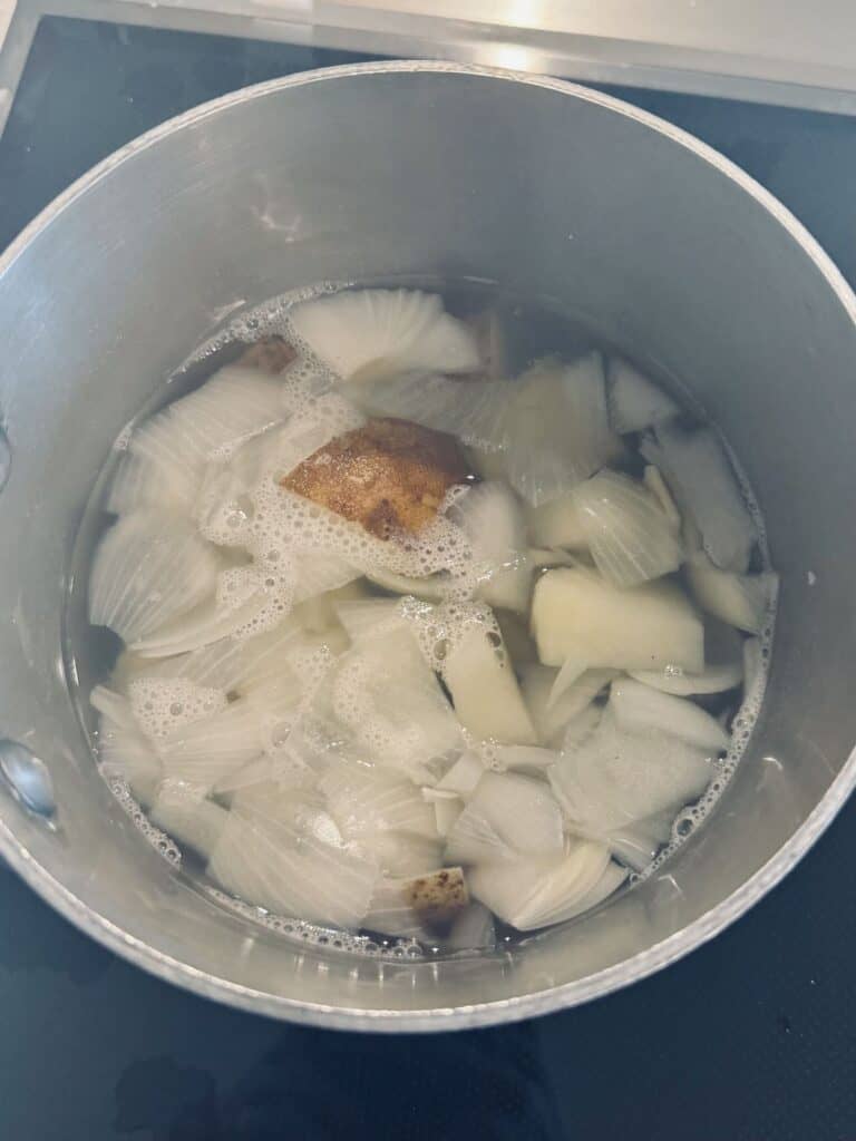 Potatoes and onion boiling.