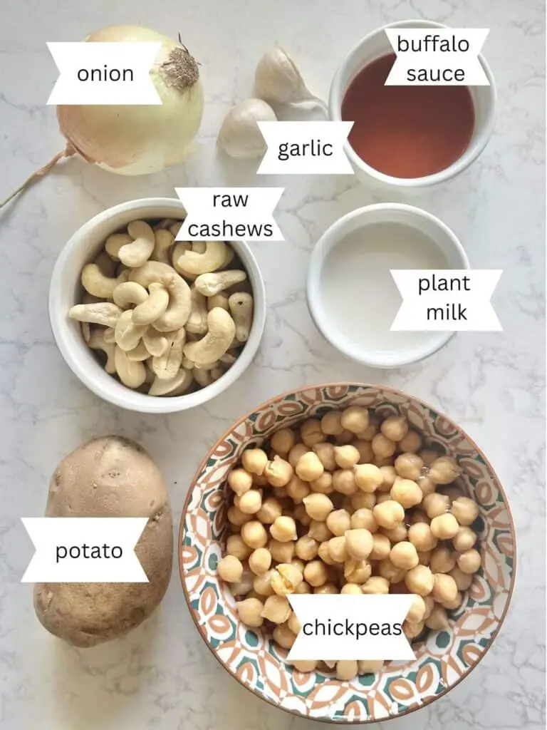 Vegan Buffalo Chickpea Dip ingredients labeled on white countertop.