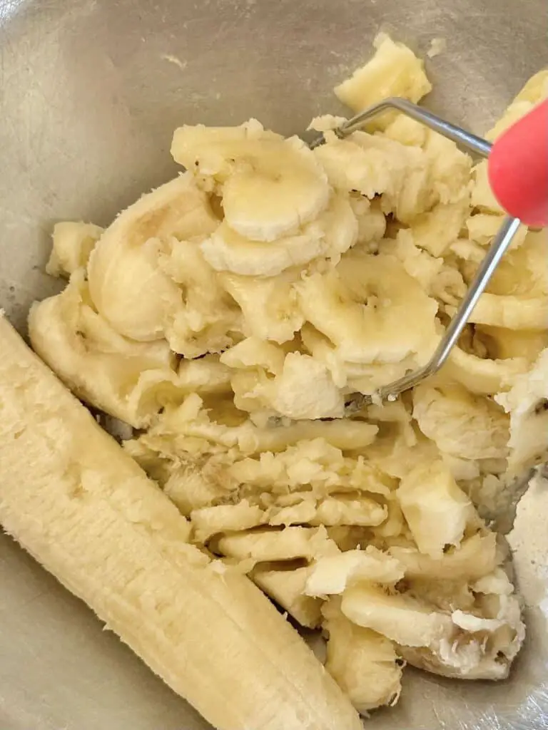 Mash bananas with potato masher or fork.