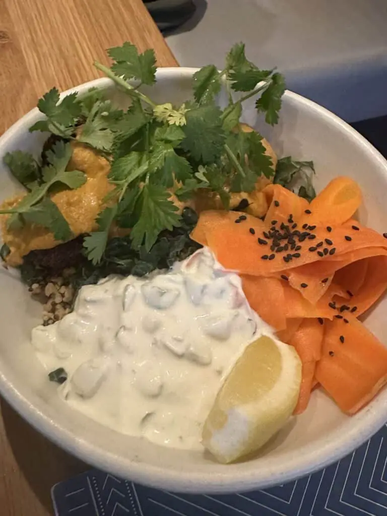 Neatball Marsalla in a white bowl on wooden table at Rad Radish.